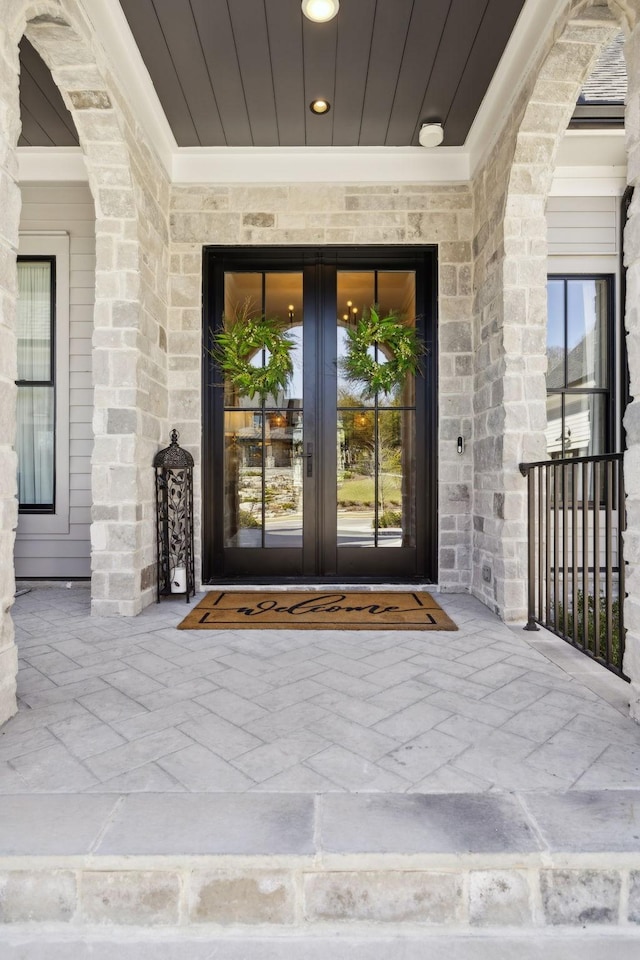 entrance to property with stone siding