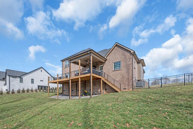 rear view of house featuring ceiling fan, brick siding, stairs, a yard, and a patio area