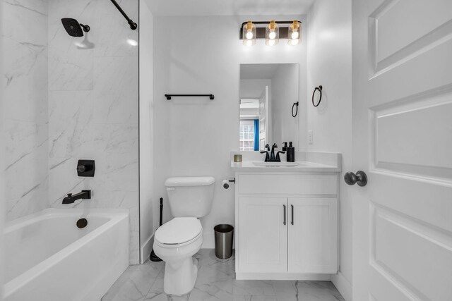 full bathroom featuring marble finish floor, toilet, vanity,  shower combination, and baseboards