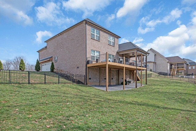 back of property featuring brick siding, a patio, a lawn, fence private yard, and stairs