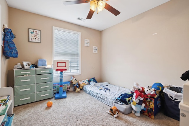 bedroom with ceiling fan, carpet floors, and visible vents