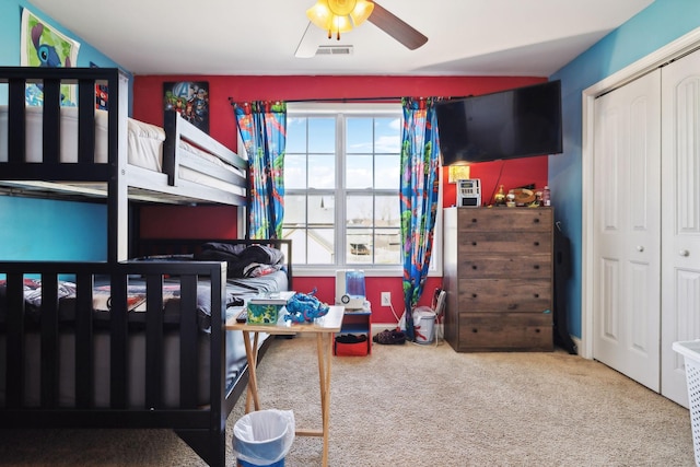 bedroom featuring a closet, carpet flooring, and visible vents