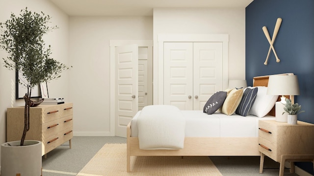 carpeted bedroom featuring a closet and baseboards