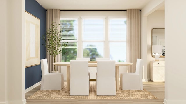 dining room with wood finished floors and baseboards