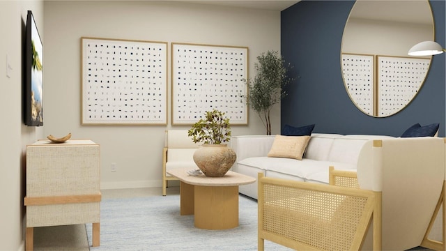 living area with carpet floors and baseboards