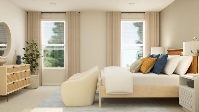 carpeted bedroom featuring multiple windows