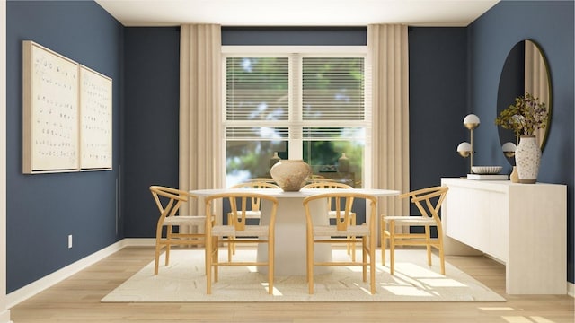 dining room featuring baseboards and wood finished floors