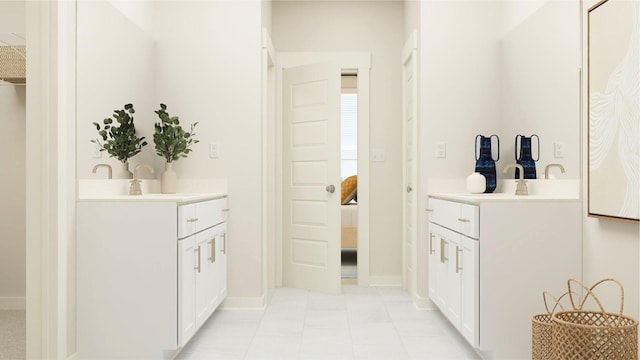 bathroom with tile patterned floors, ensuite bath, baseboards, and vanity