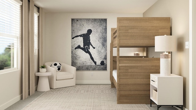 carpeted bedroom featuring multiple windows and baseboards