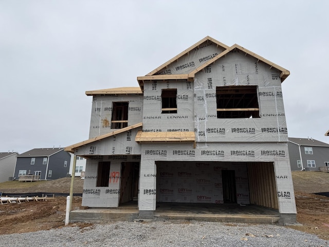 property in mid-construction with an attached garage