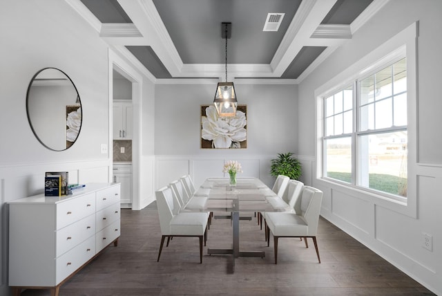 dining space featuring visible vents, a decorative wall, dark wood-style flooring, and ornamental molding