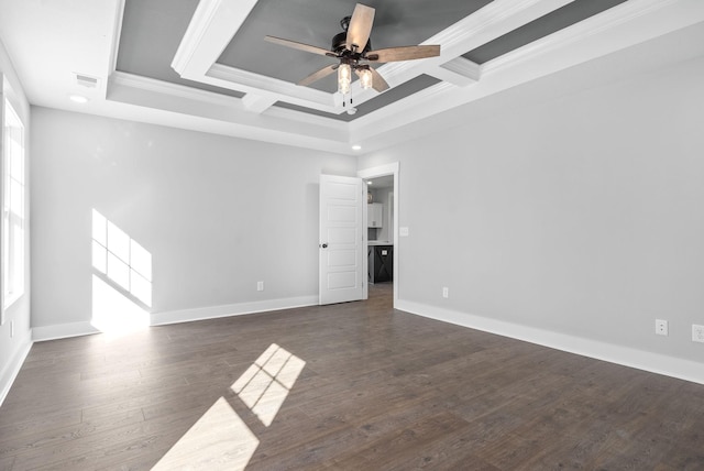 spare room with ceiling fan, wood finished floors, visible vents, baseboards, and crown molding