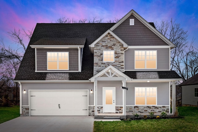 craftsman-style house with stone siding, roof with shingles, driveway, and an attached garage