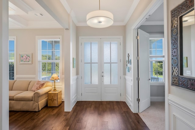 doorway featuring visible vents, french doors, ornamental molding, wainscoting, and dark wood finished floors