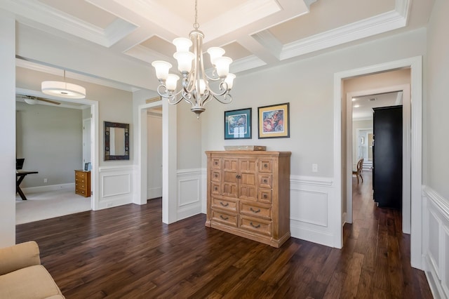 dining room featuring crown molding, coffered ceiling, dark wood finished floors, and beamed ceiling