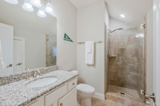 full bath with a stall shower, baseboards, toilet, tile patterned floors, and vanity