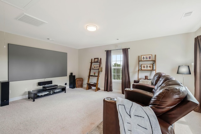 carpeted living area featuring baseboards, visible vents, and attic access