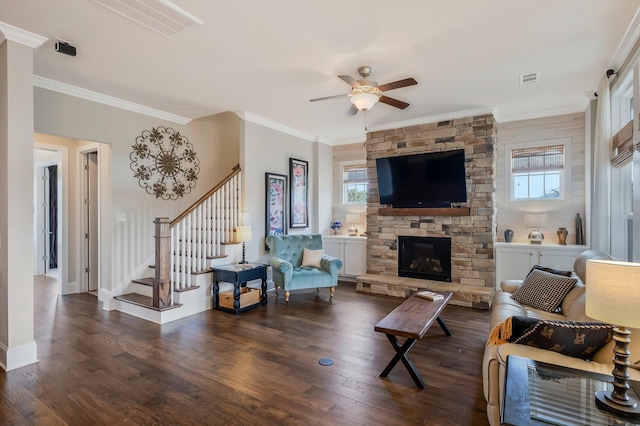 living room with a wealth of natural light, stairs, and wood finished floors