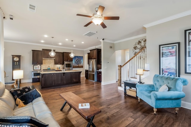 living area featuring dark wood-type flooring, visible vents, stairway, and baseboards