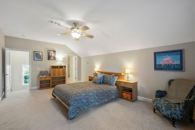 carpeted bedroom featuring vaulted ceiling, a ceiling fan, visible vents, and baseboards