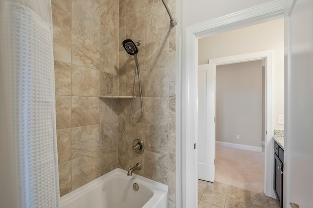 bathroom featuring shower / bath combination with curtain, vanity, and baseboards