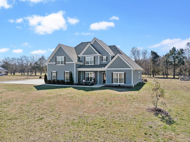 view of front of home featuring a front lawn and board and batten siding