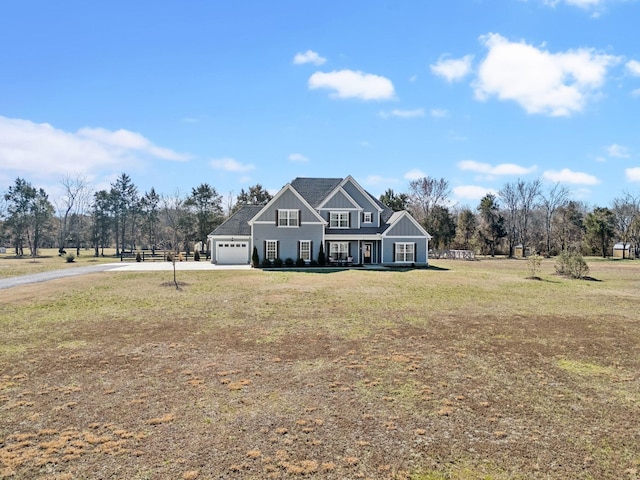 view of front facade with board and batten siding, a garage, a front lawn, and concrete driveway