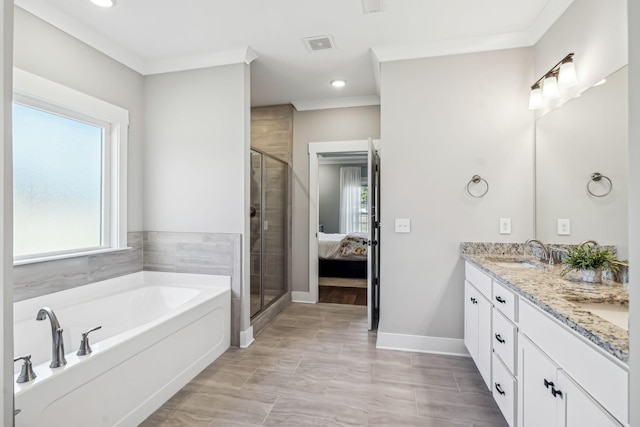 full bath featuring double vanity, a stall shower, a sink, crown molding, and a bath