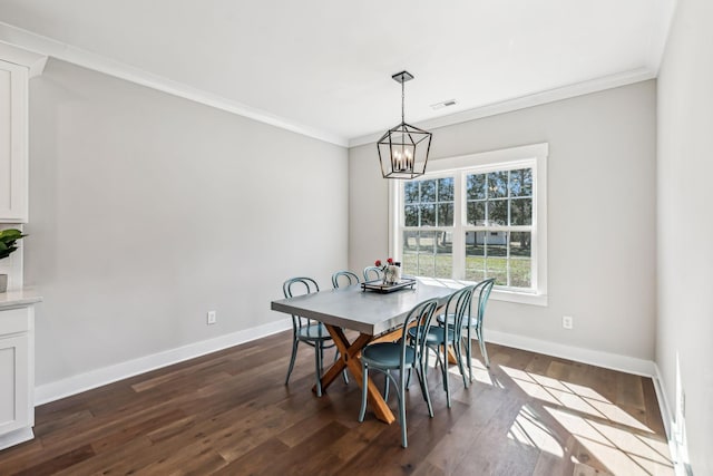 dining space featuring baseboards, dark wood-style flooring, visible vents, and crown molding