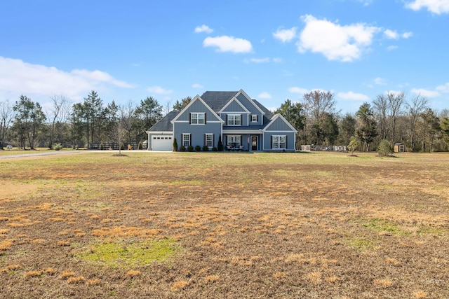 craftsman house featuring a garage, a front lawn, and board and batten siding