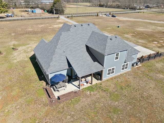 birds eye view of property with a rural view