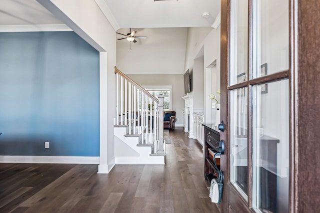 entryway with dark wood-style floors, ceiling fan, stairway, and baseboards