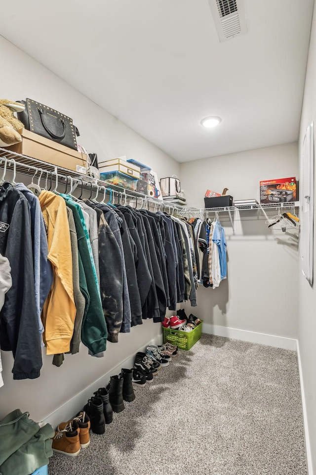 spacious closet featuring carpet floors and visible vents