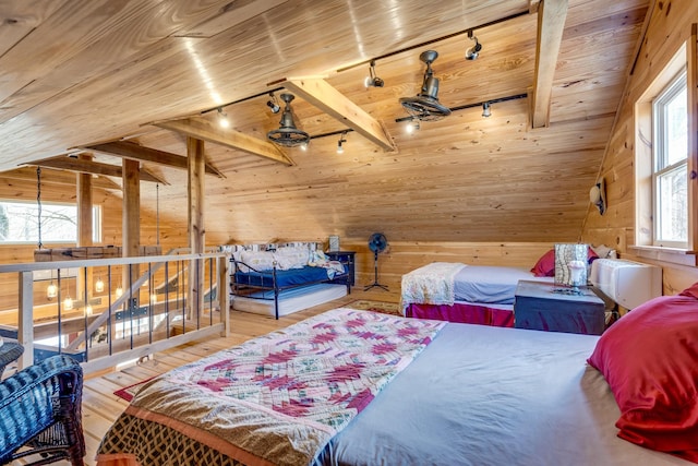 bedroom featuring vaulted ceiling with beams, wood walls, wood ceiling, and hardwood / wood-style flooring