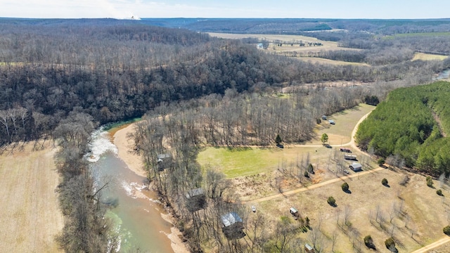 birds eye view of property with a wooded view and a rural view