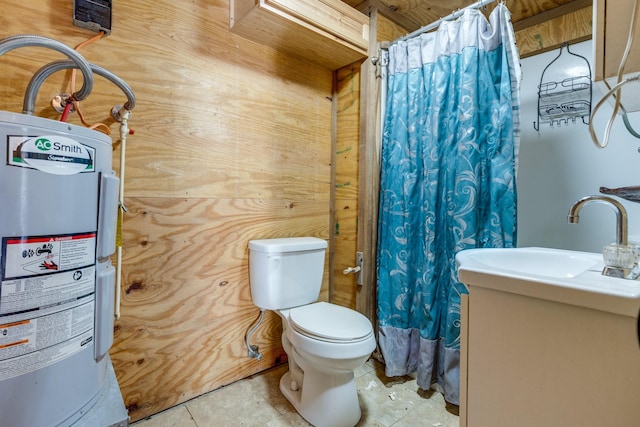 full bathroom featuring curtained shower, water heater, toilet, vanity, and tile patterned floors