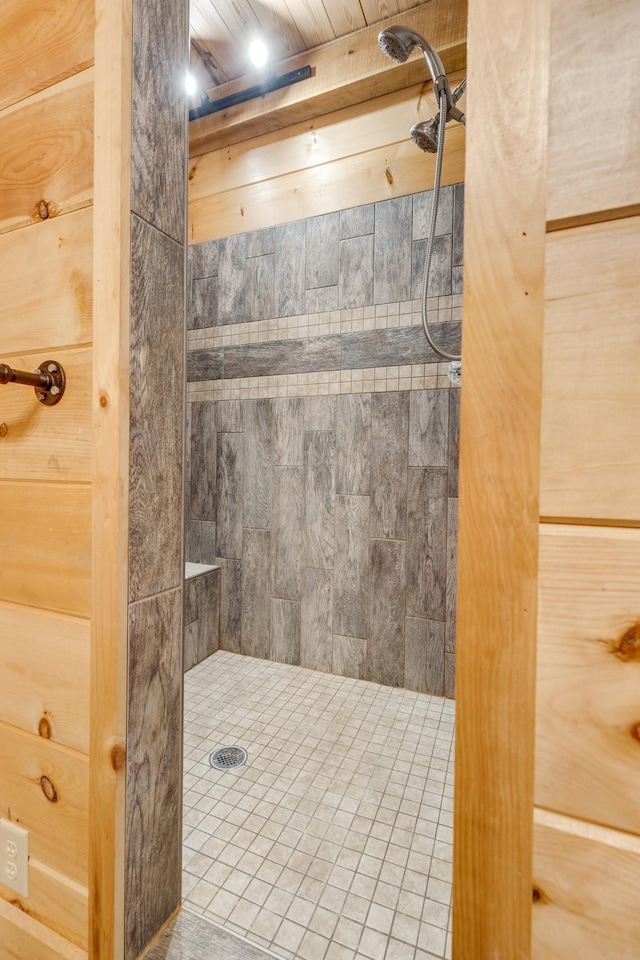 bathroom with tiled shower