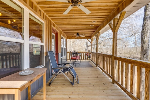 wooden deck featuring a ceiling fan