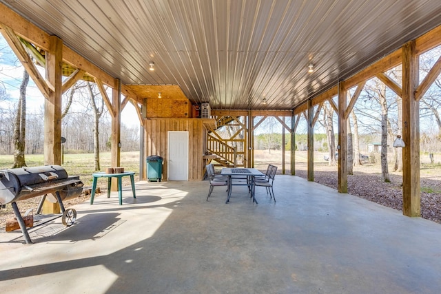 view of patio featuring outdoor dining space and a grill