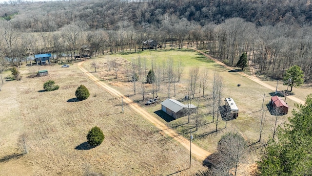 drone / aerial view with a rural view and a view of trees