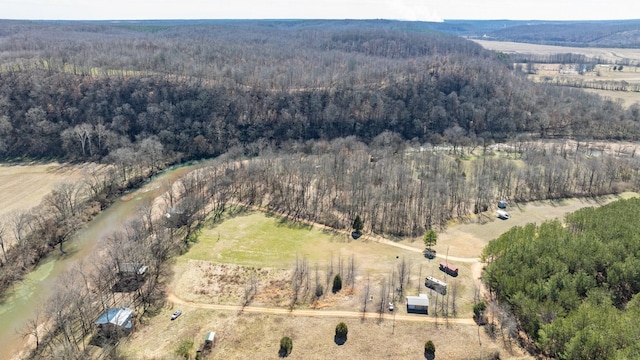 drone / aerial view featuring a forest view and a rural view