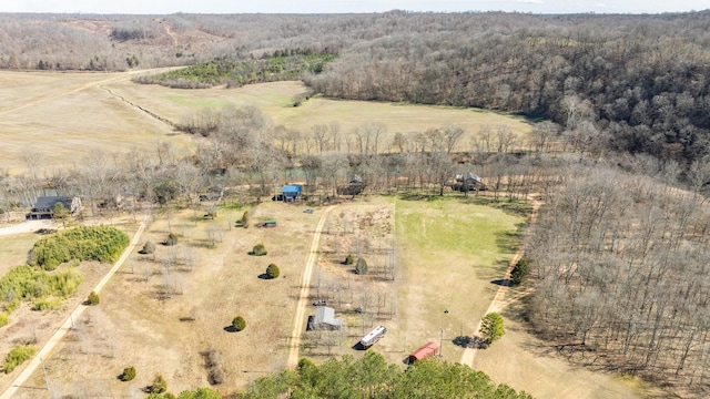 birds eye view of property featuring a rural view and a view of trees