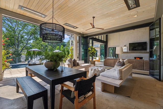 view of patio featuring a ceiling fan, outdoor dining area, and outdoor lounge area