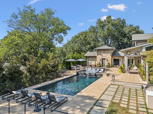 view of pool with a patio area, fence, and a fenced in pool