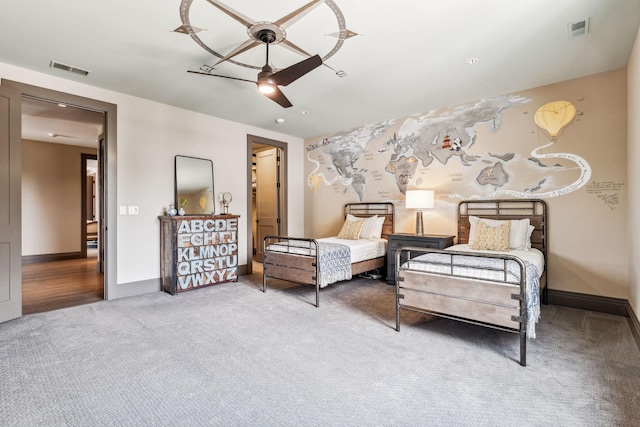 carpeted bedroom with visible vents, ceiling fan, and baseboards