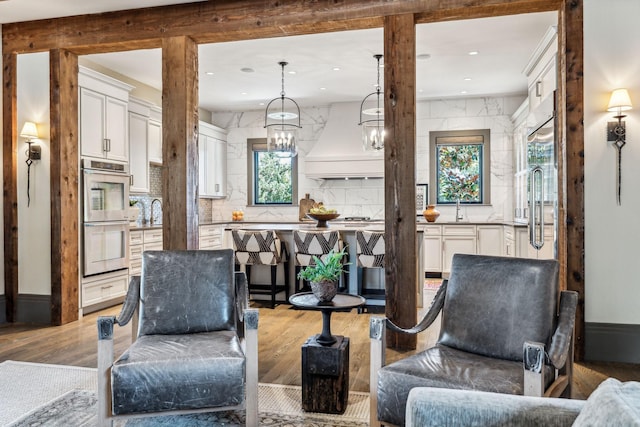 living room featuring light wood-style flooring and recessed lighting