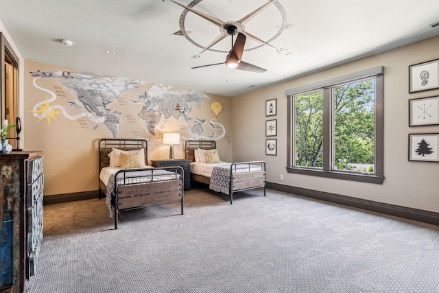 bedroom featuring ceiling fan, baseboards, and carpet flooring