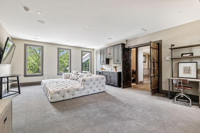 living area with light carpet, visible vents, baseboards, and recessed lighting