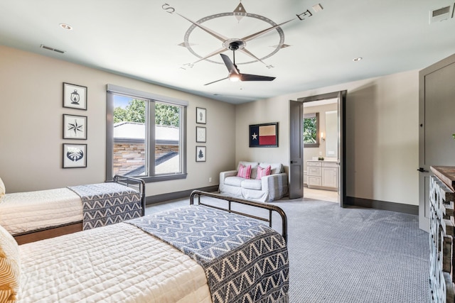 bedroom featuring ensuite bathroom, carpet, visible vents, and baseboards