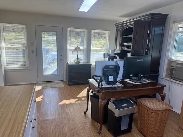 home office with wood finished floors